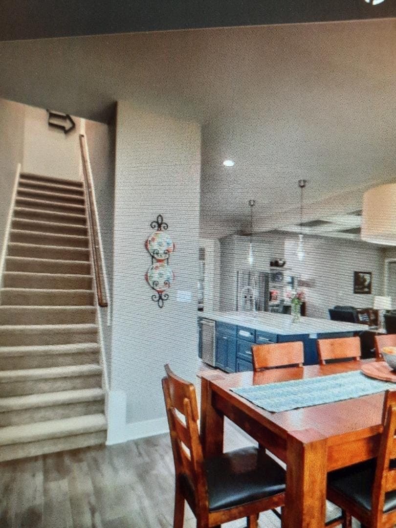 Open dining and kitchen with navy island