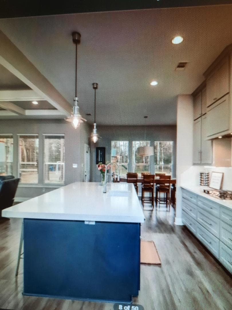 Open kitchen dining with navy island