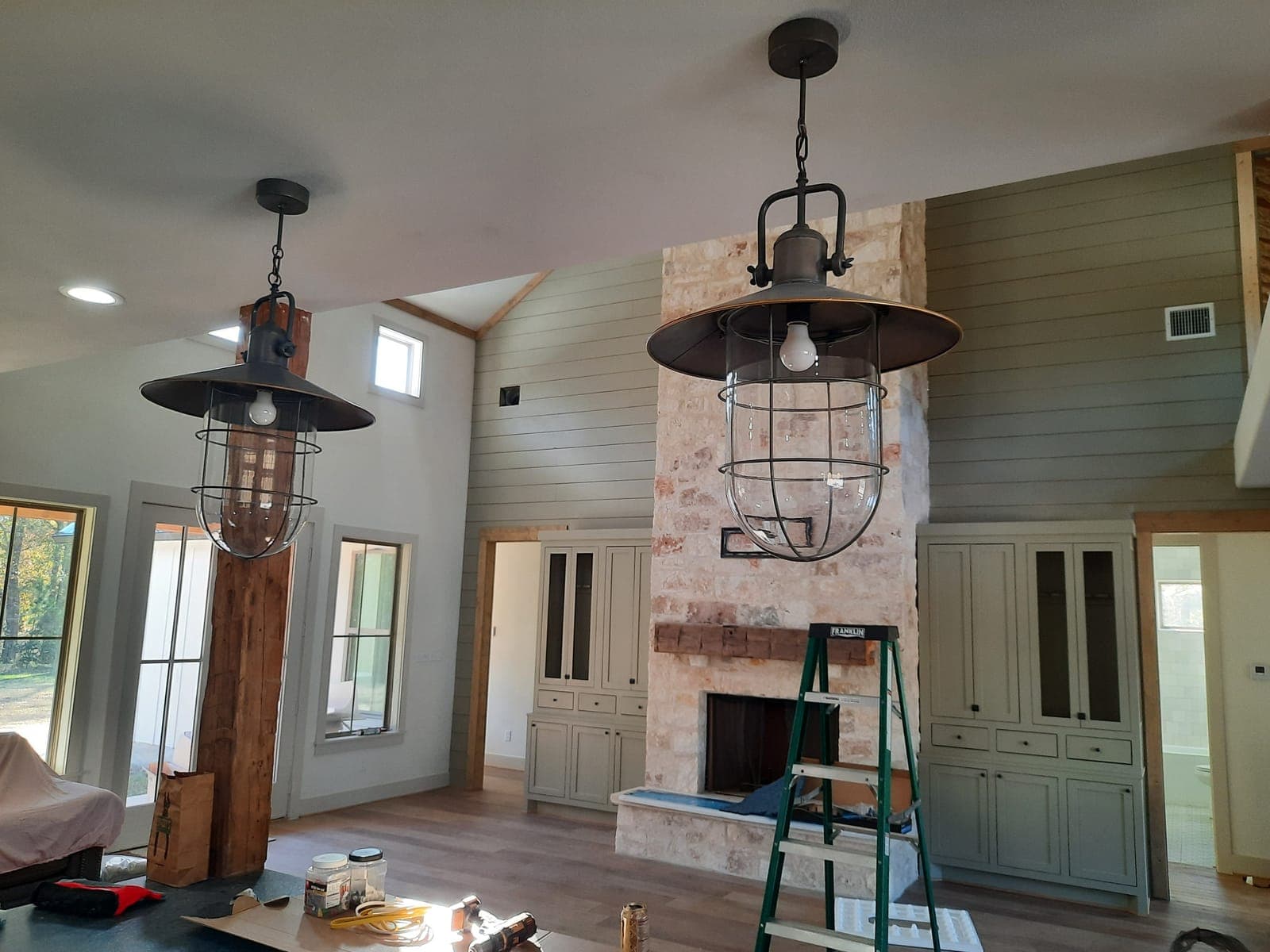 Stone fireplace and built-ins during finish stage