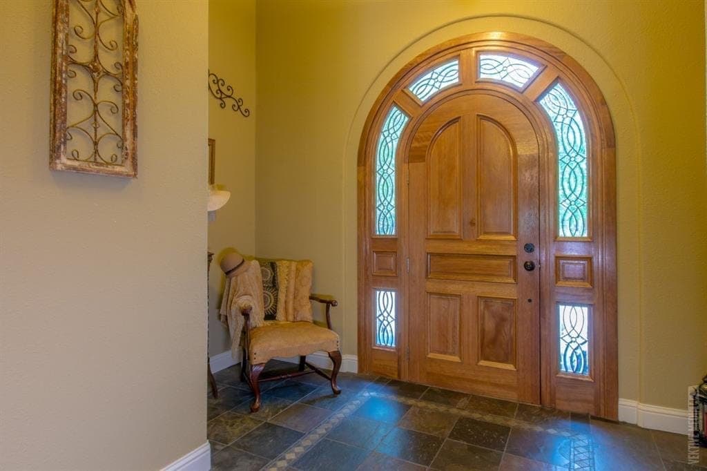 Arched wood entry with leaded glass