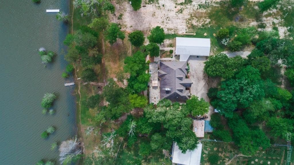 Aerial of waterfront custom home and docks