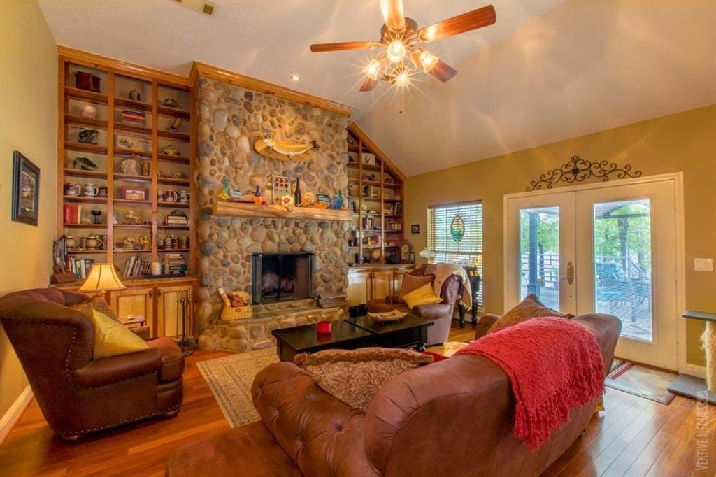 River-stone fireplace and built-in bookshelves