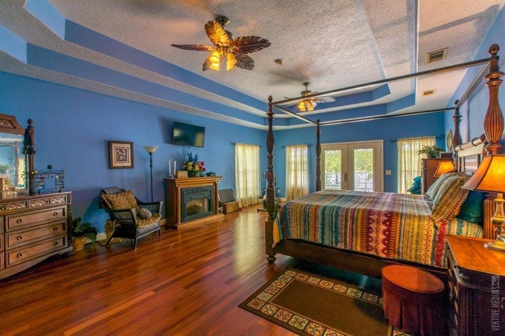 Master bedroom with multi-tier tray ceiling