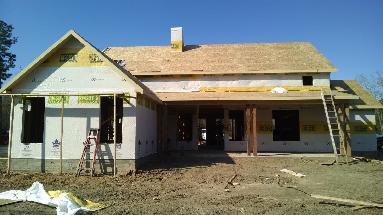 Large custom home framing with house wrap