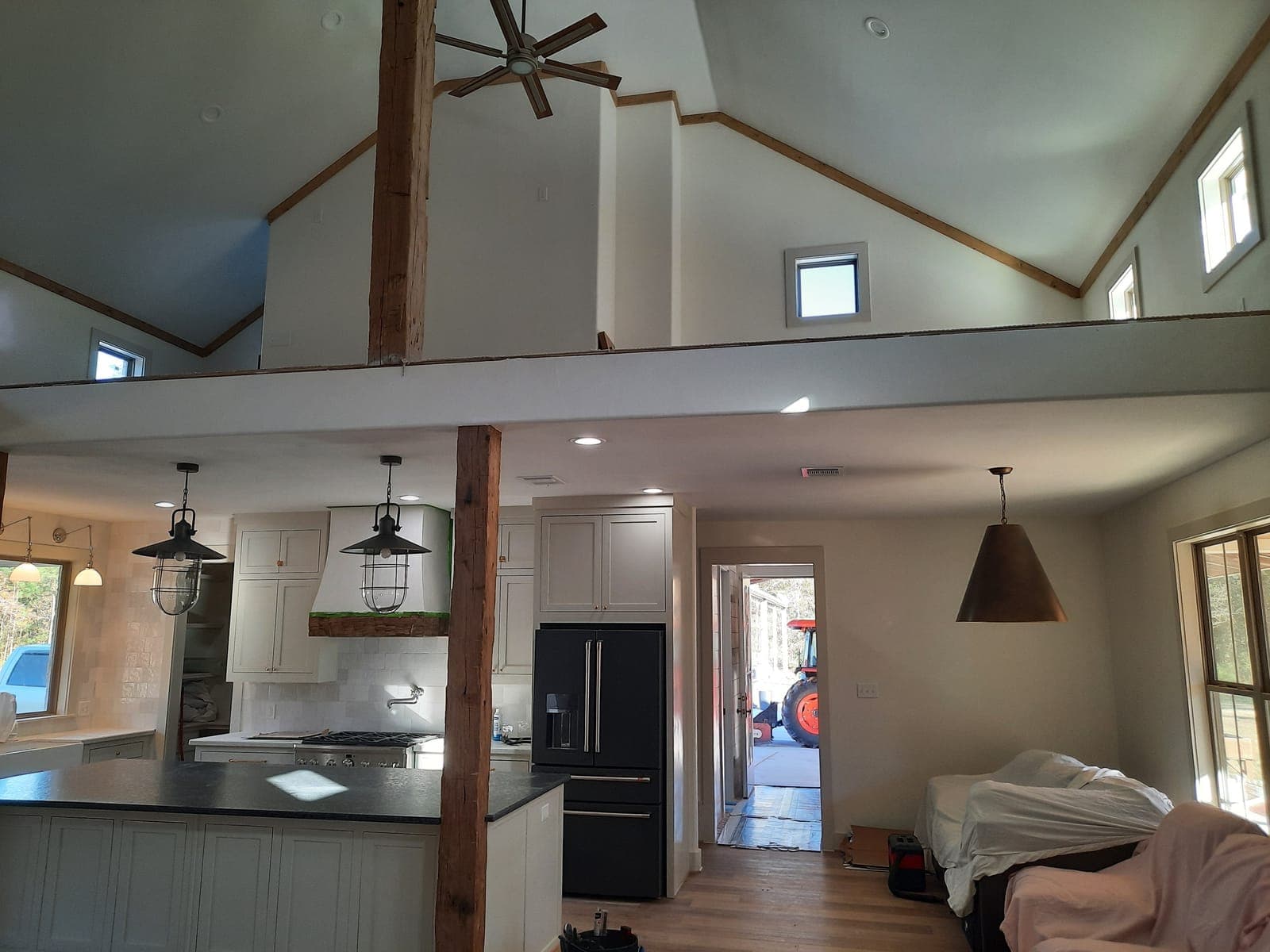 Open-concept kitchen living with vaulted loft